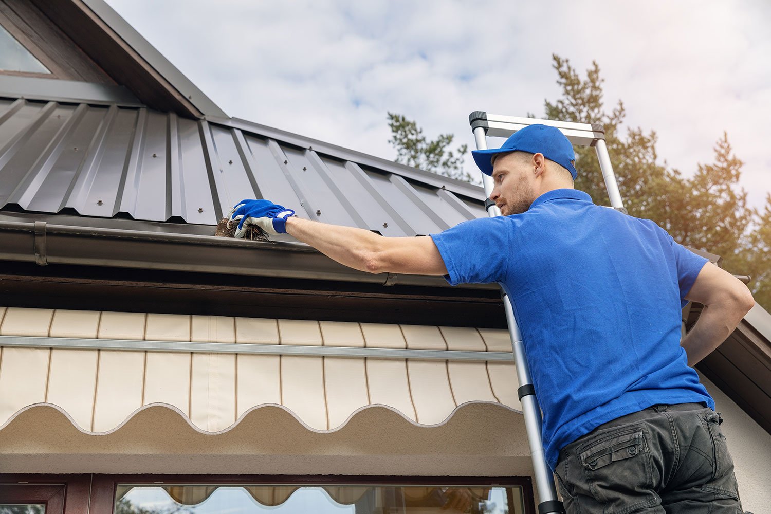 cleaning gutters before spray wash