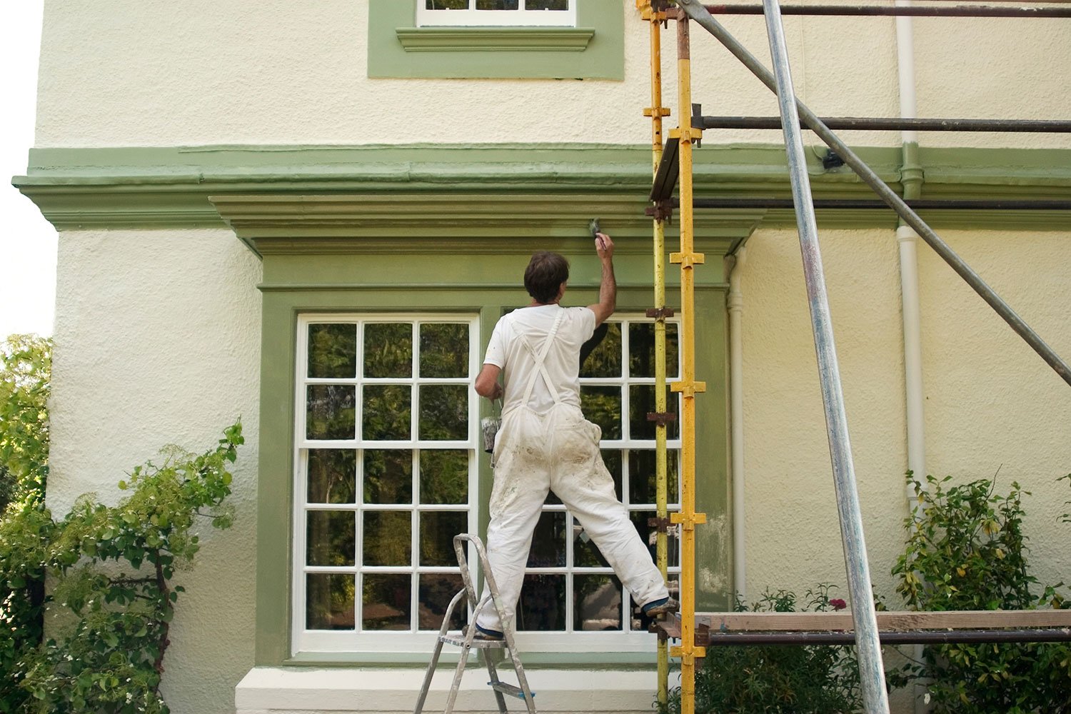 house painter working on whole house