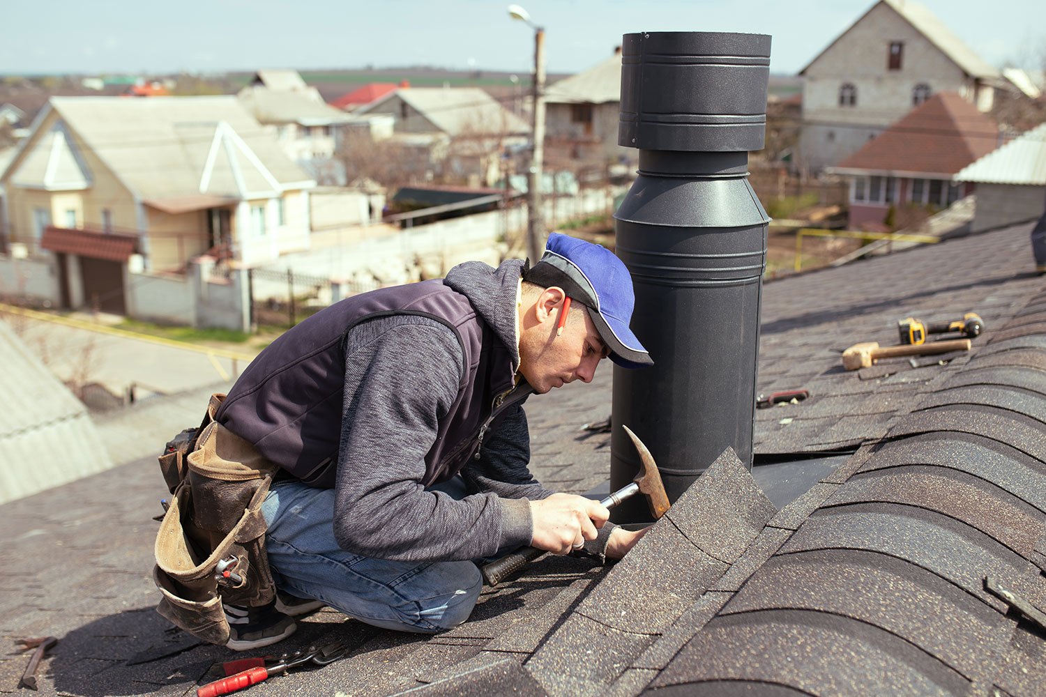roofer checking roof materials